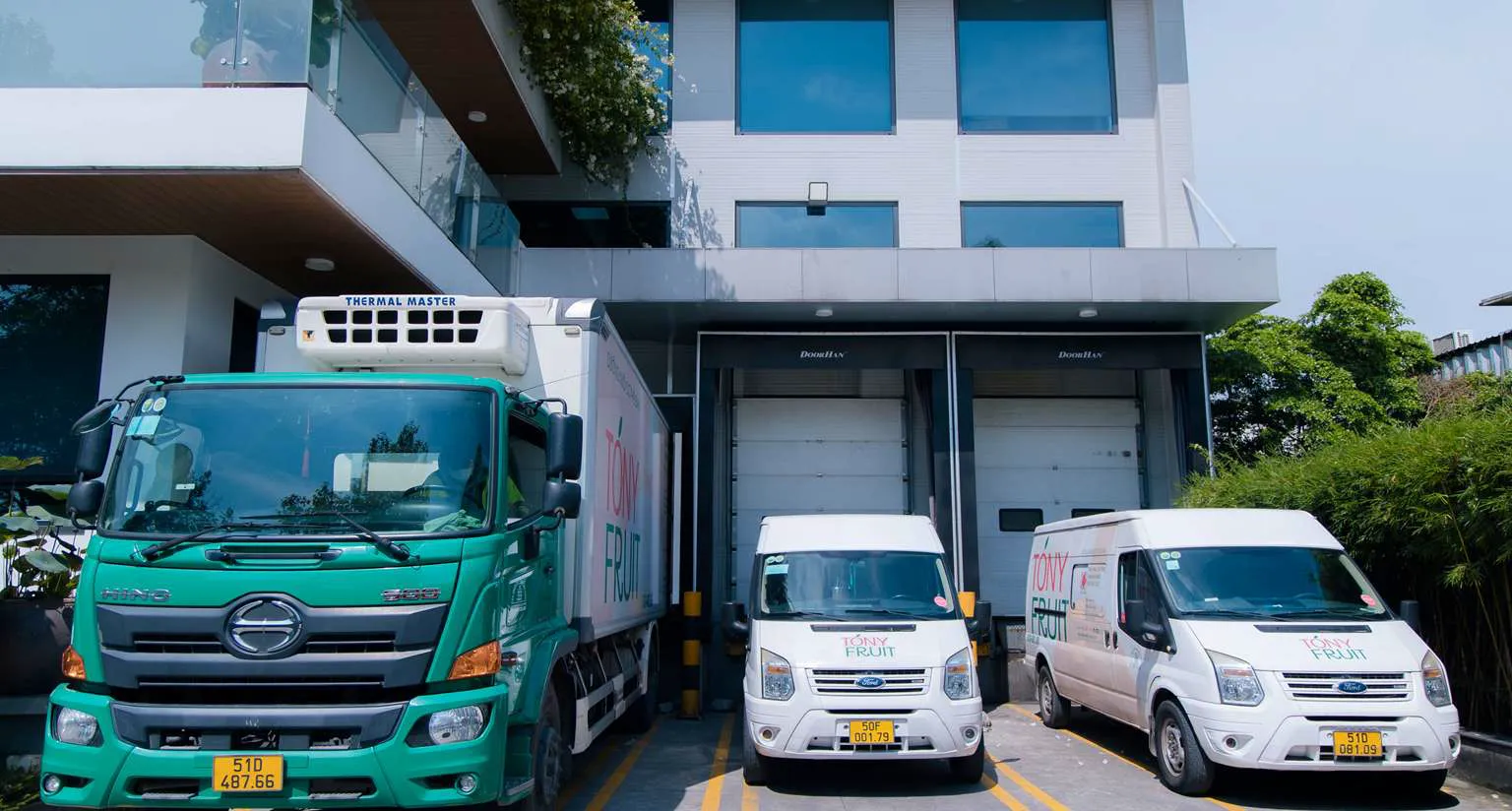 Tony Fruit delivery fleet — refrigerated trucks and containers